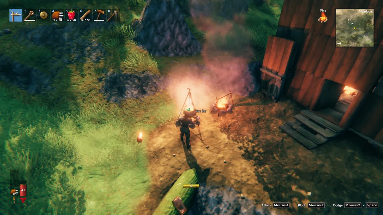 Valheim campfire showing a Too far prompt while the player tries to add wood to the fire