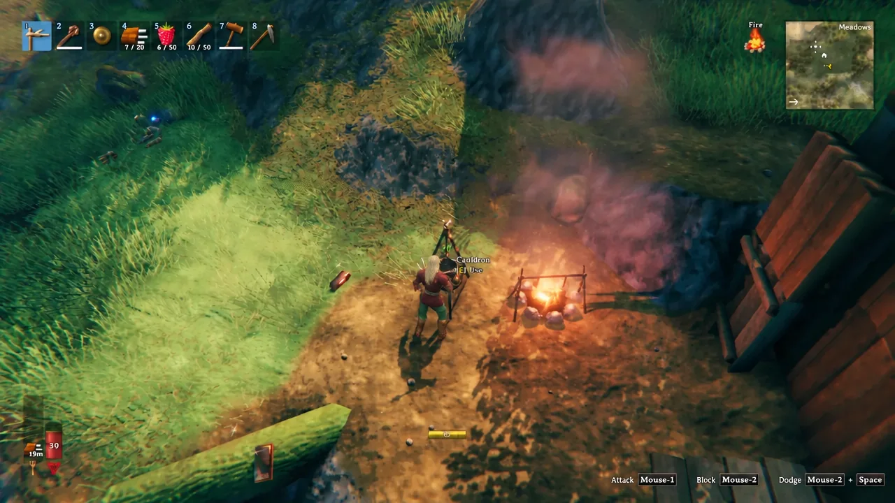 The E Use interaction prompt appearing next to a Cauldron in Valheim