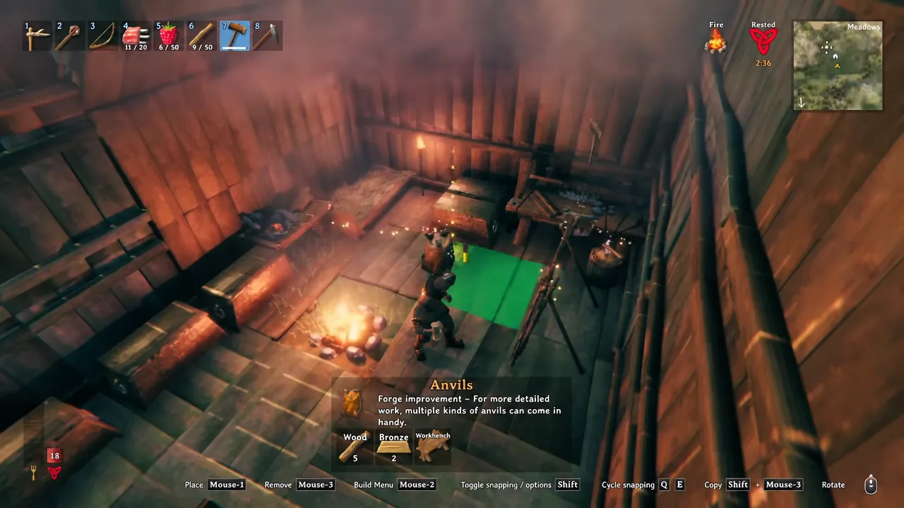 Green Anvils placement preview lined up on the workshop floor beside the Forge