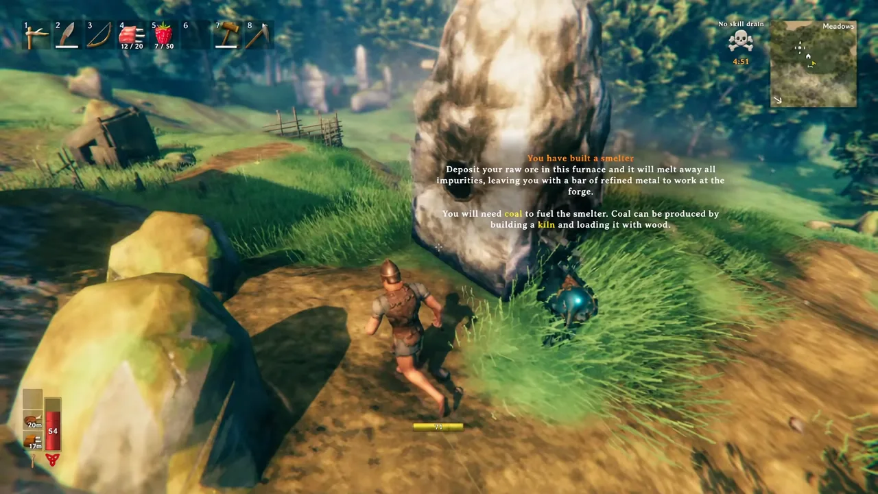 On-screen tutorial popup explaining that raw ore is deposited in the furnace and coal is needed as fuel