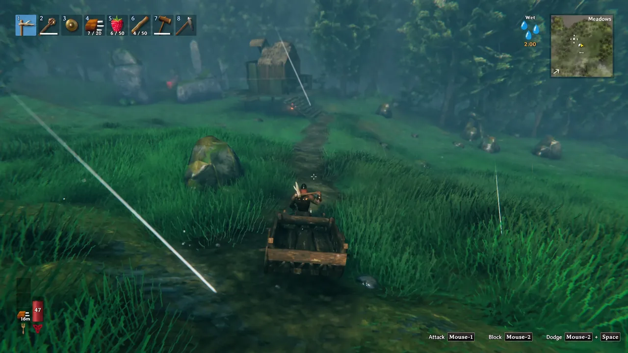 Cart being hauled along a grassy path toward a wooden shelter in Valheim