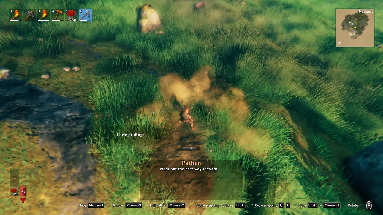 A finished dirt path running between two wooden houses in Valheim