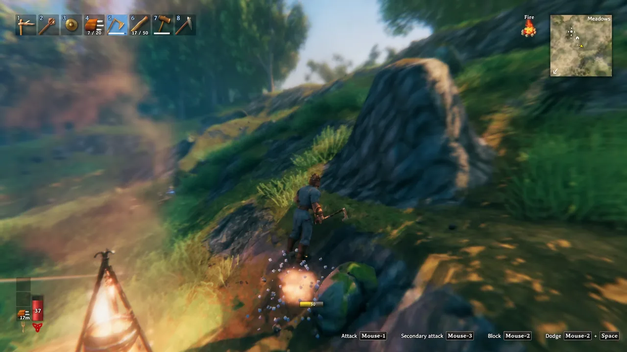 Player swinging a pickaxe at an ore rock in Valheim with hotbar slot 5 active