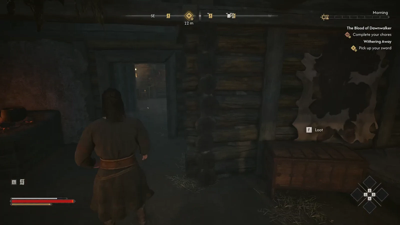 Loot prompt showing beside a container inside the hut as Coen walks toward the back room