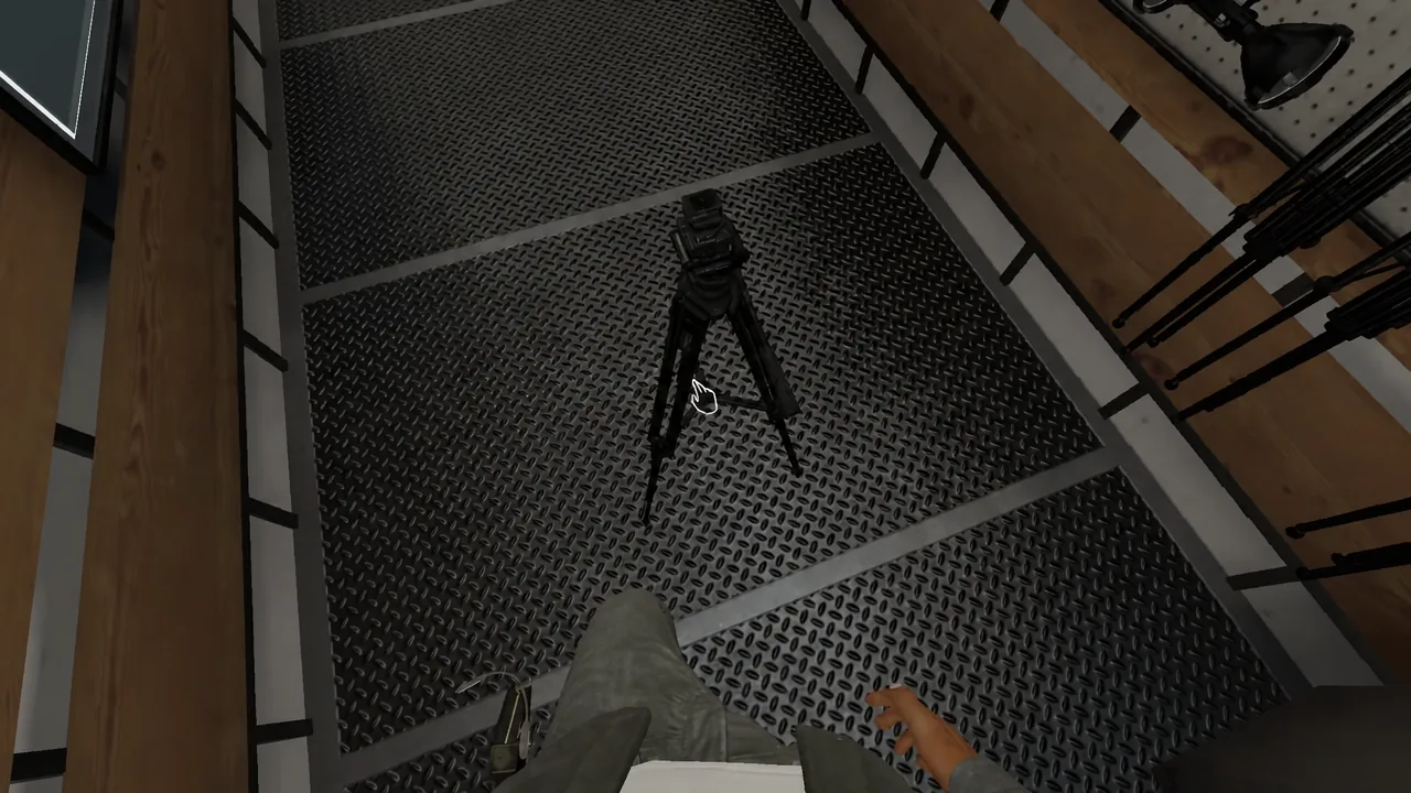Tripod standing on the floor with the grab prompt highlighted over it
