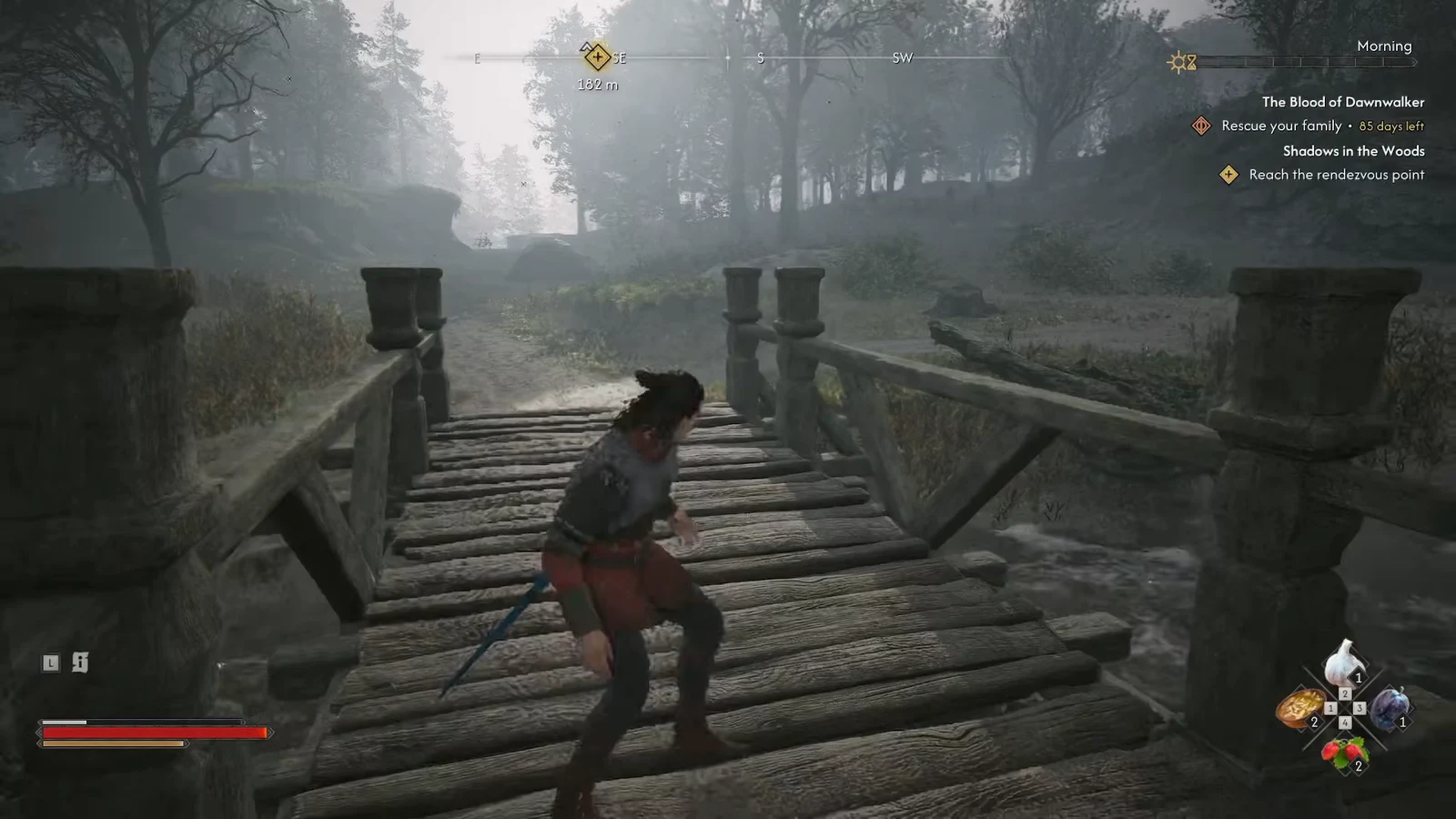Coen crossing a wooden bridge on the way to the Shadows in the Woods rendezvous point