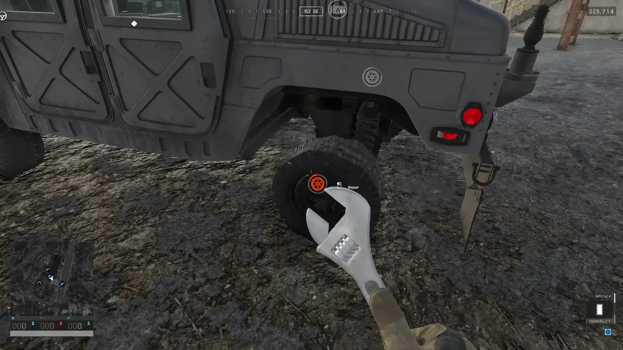 Repair prompt highlighted on a vehicle's rear wheel while using the wrench