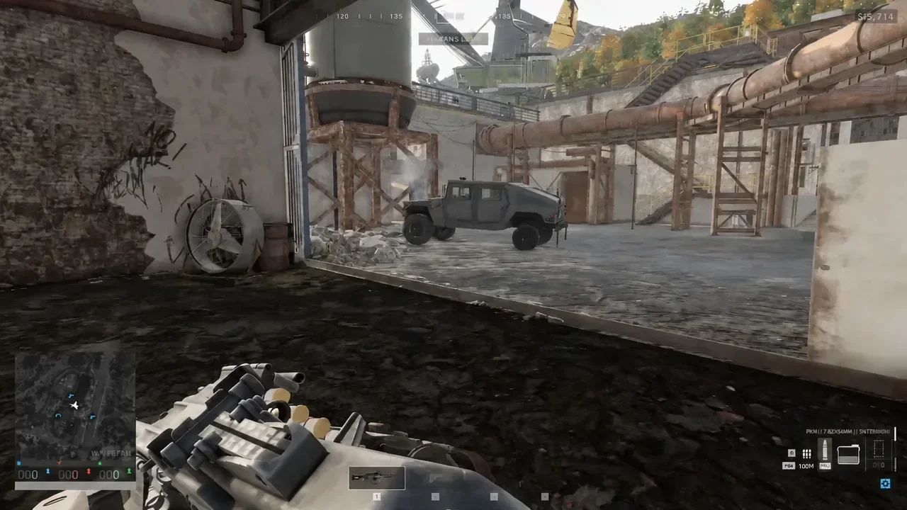 First-person view of a player approaching an armored vehicle parked in an industrial yard