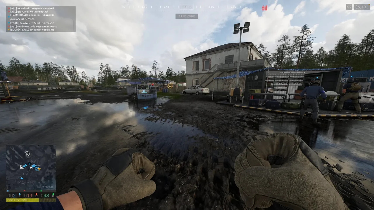 SAFE ZONE indicator on screen as the player walks toward the objective in an outdoor depot