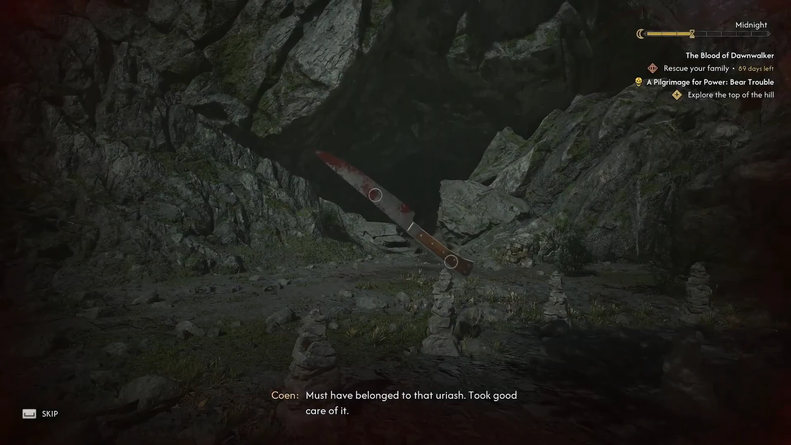 Coen examining the bloodied blade in a rocky cavern during the inspection scene