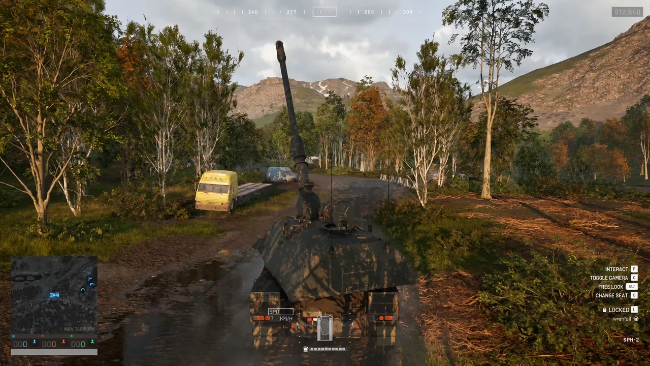 Tank driving forward down a dirt road with the full vehicle control prompts displayed