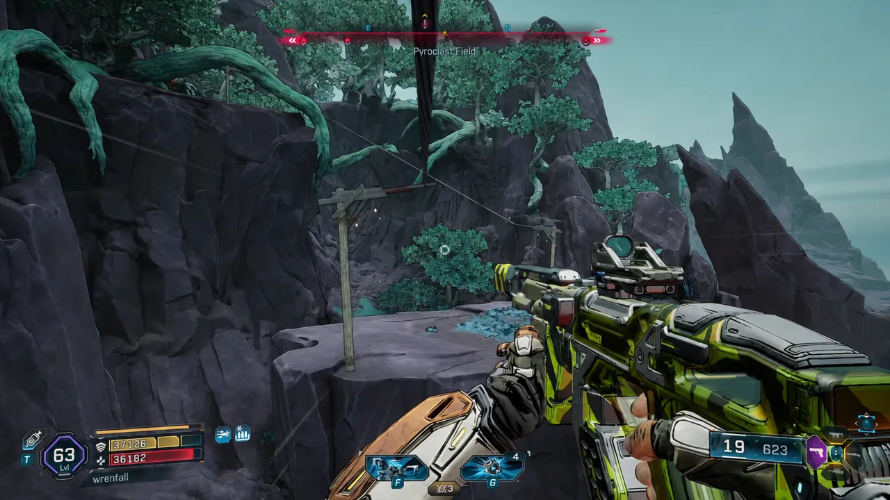 Pyroclast Field seen in first person, weapon raised while looking across a rocky forested ledge