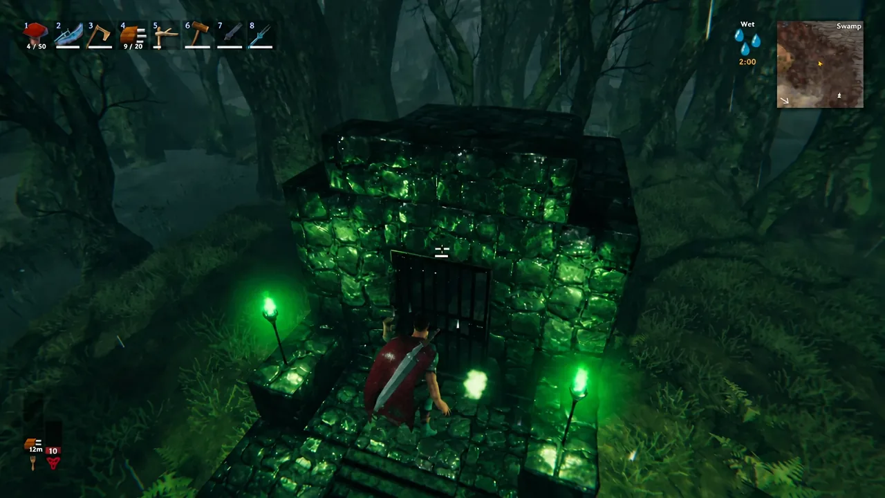 Player standing at the barred Iron Gate of a glowing Sunk Crypt entrance in the Swamp