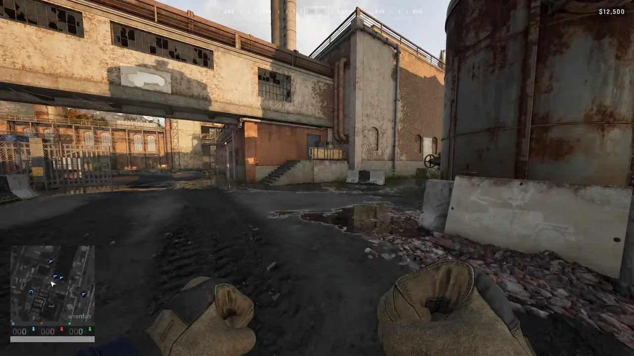 Player moving through an industrial courtyard with the minimap and HUD on screen in Wardogs