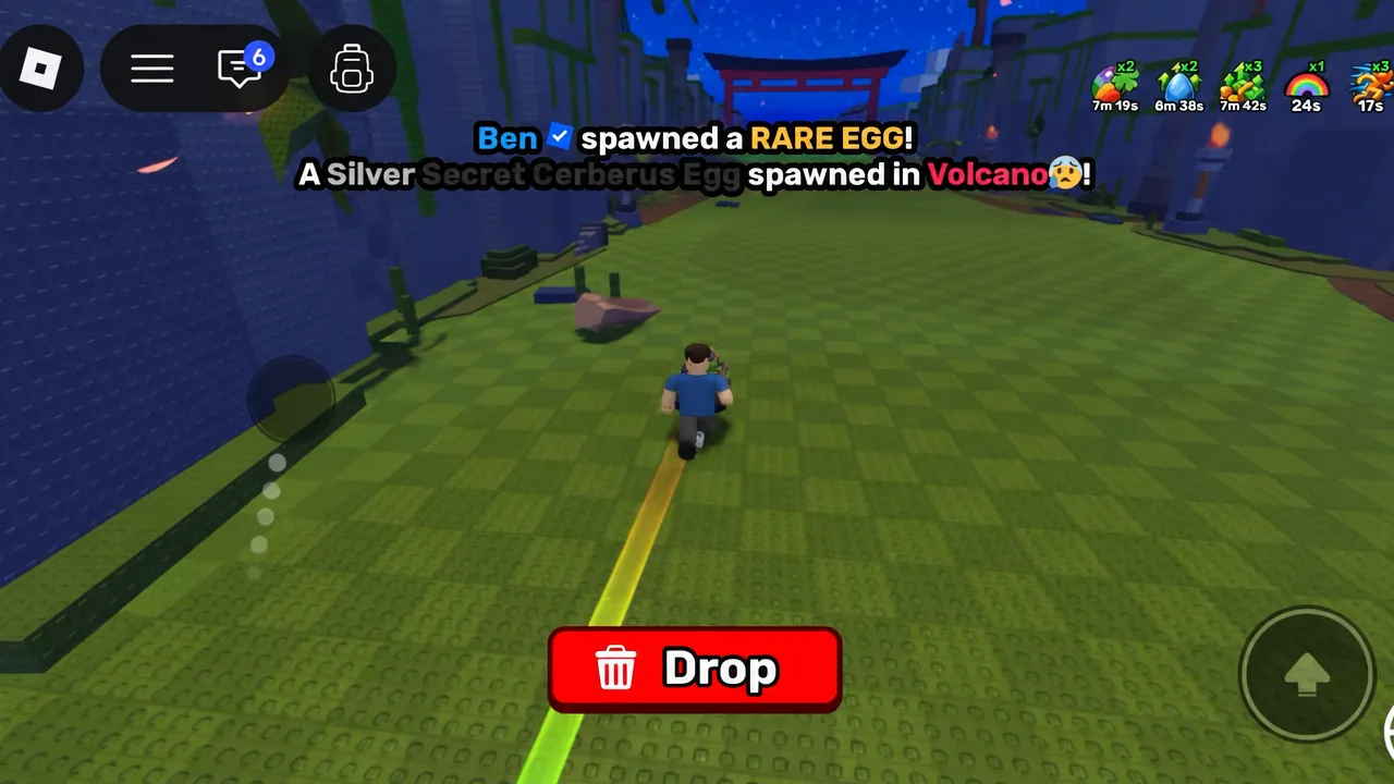 Highlighted Drop button on the gameplay HUD used to release a carried item