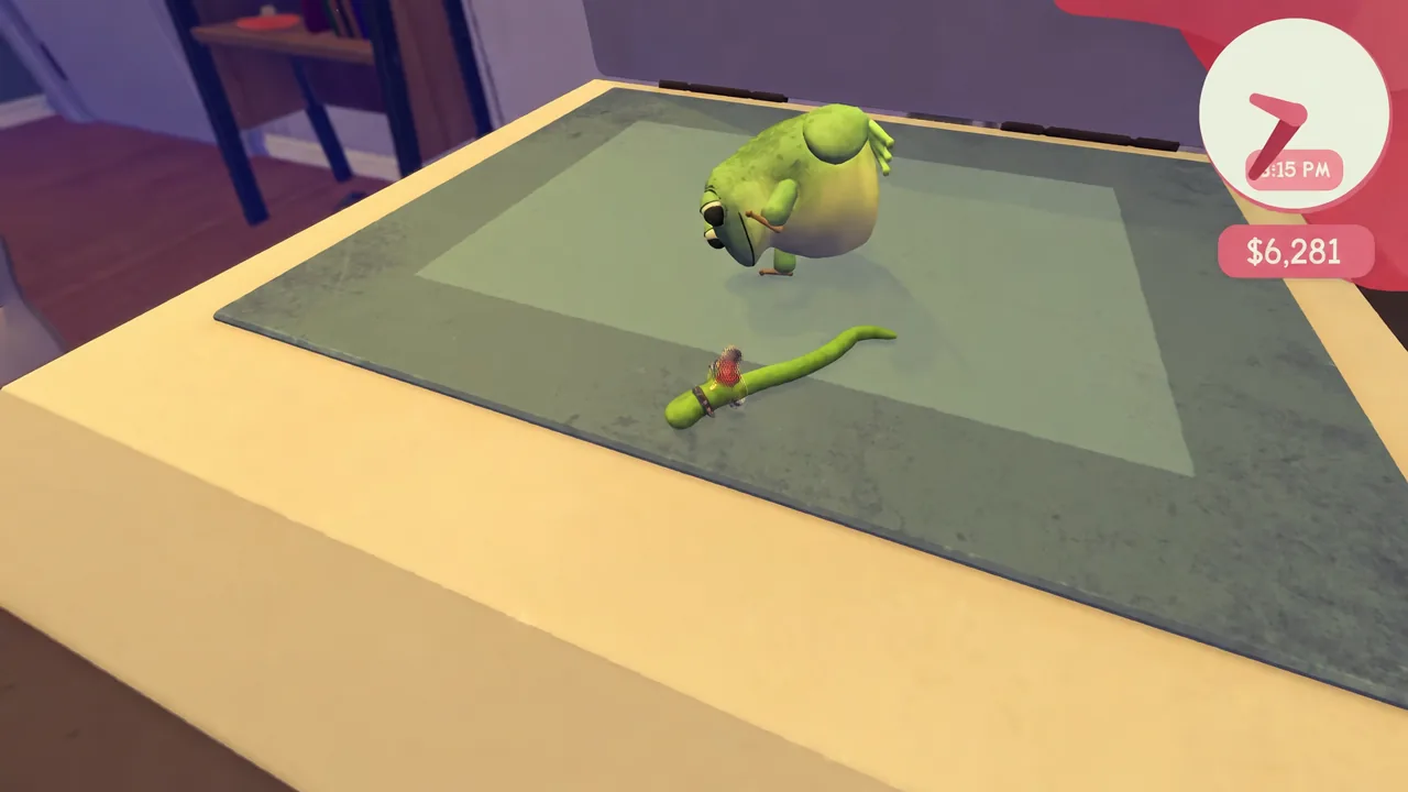 The worm meets a small frog-like creature on the desk surface during gameplay