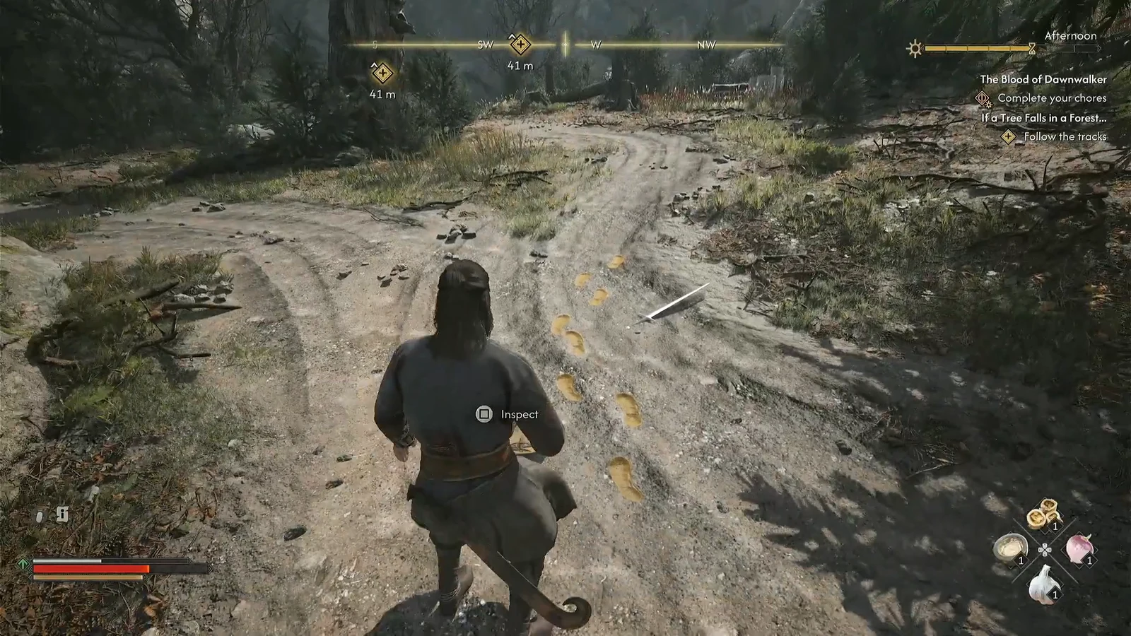 Inspect prompt on screen above highlighted footprints in the forest during the tracking objective