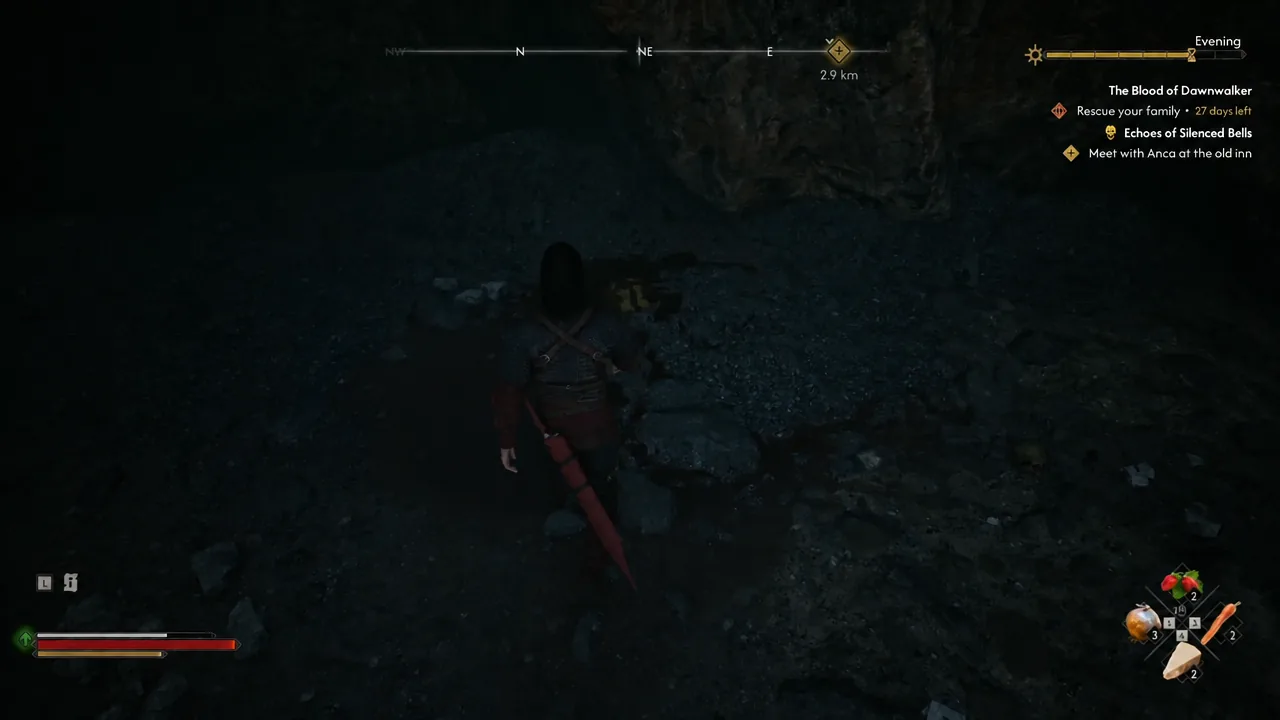 Coen searching the dark interior of the bear den with the quest objective tracked on the right