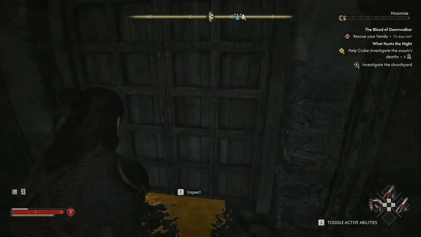 Coen standing in front of the wooden tower door with the inspect prompt on screen
