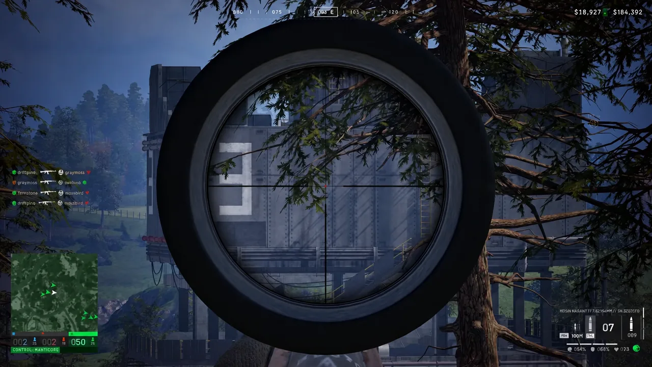 Rifle scope reticle trained on an industrial building during a WARDOGS fight