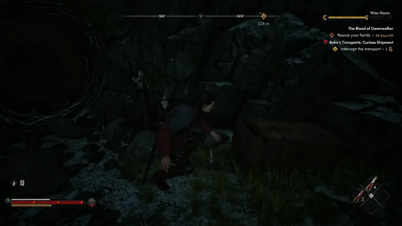 Coen crouching through a dark rocky tunnel inside the Kobold Nest