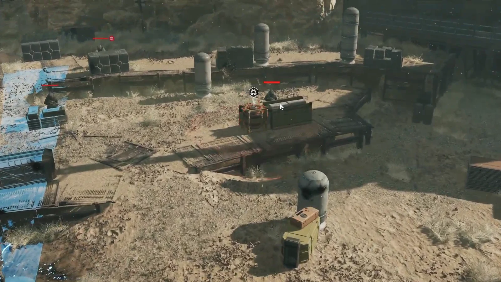 Hostile Pyke marked with a white icon while holding cover in the sandy industrial arena