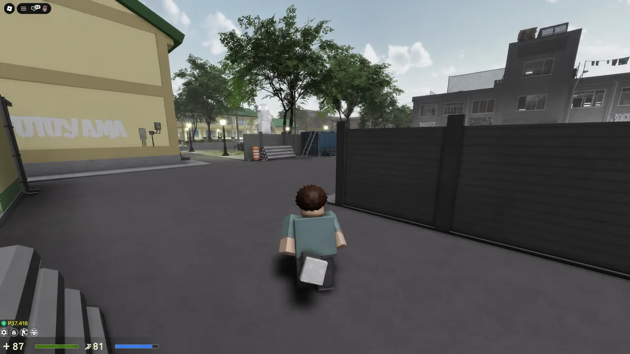 Player character walking through the outdoor Klase courtyard toward a fenced area