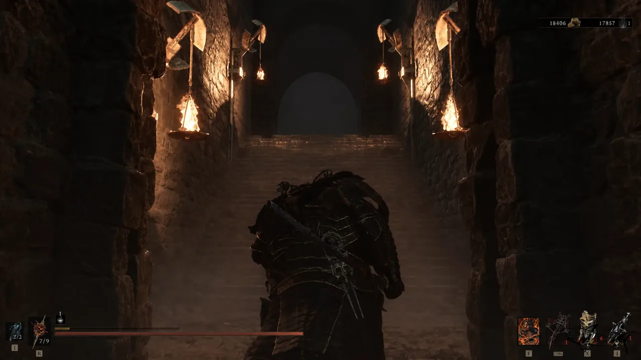 Armored player character climbing a torch-lit stone staircase inside the crypt