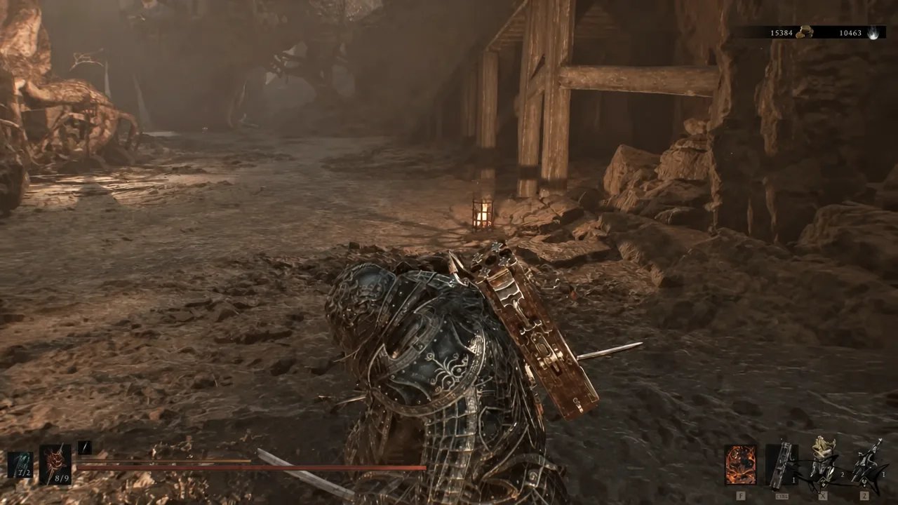 Armored player moving through a narrow rocky mine tunnel with the combat HUD visible