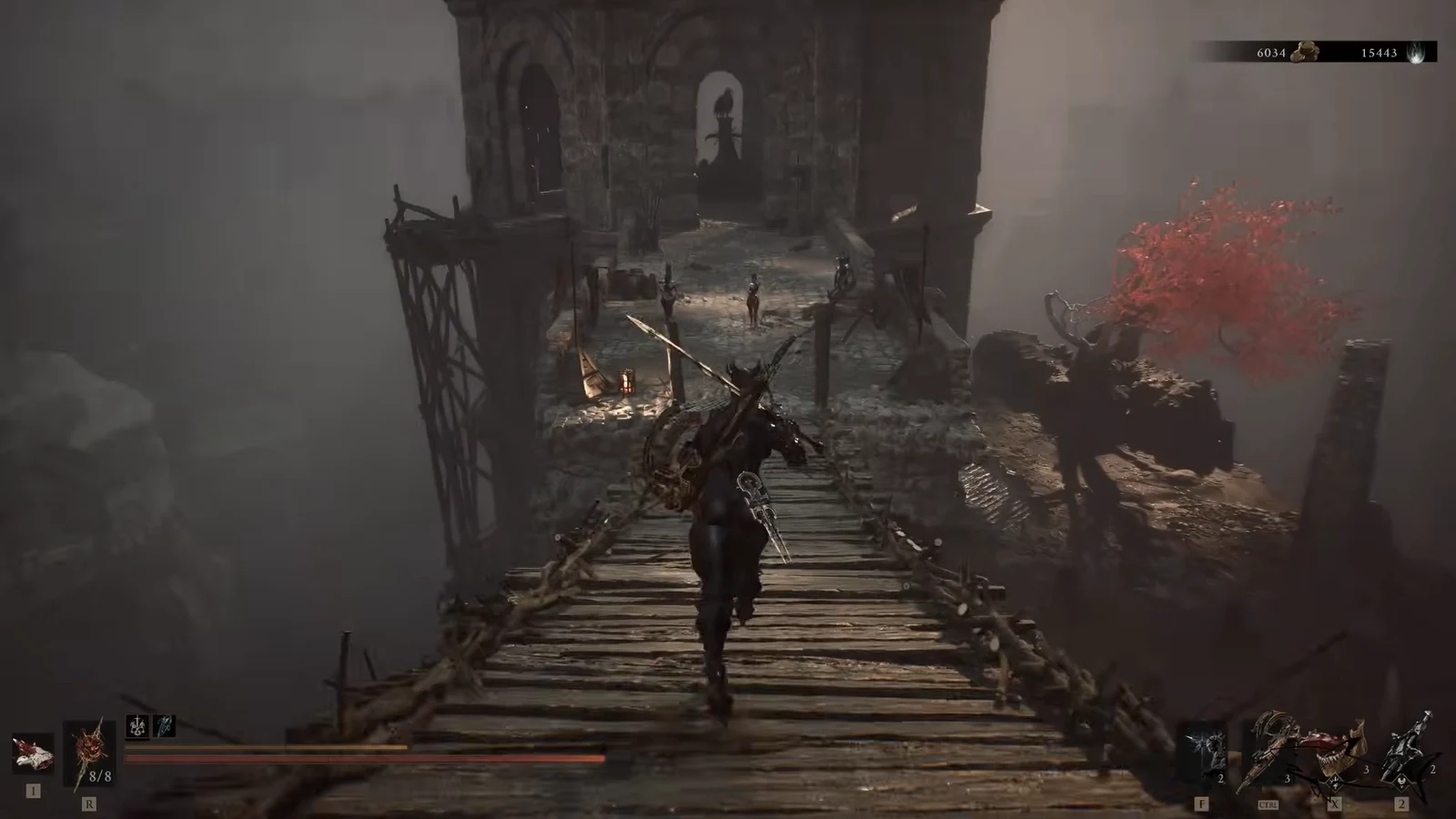 Crossing the wooden bridge toward the stone tower with enemies waiting on the far side