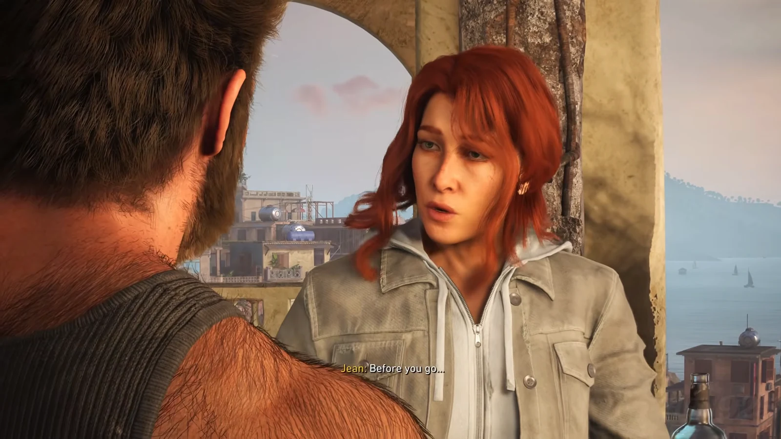 Jean speaks to Logan on a seaside rooftop with the subtitle Before you go displayed
