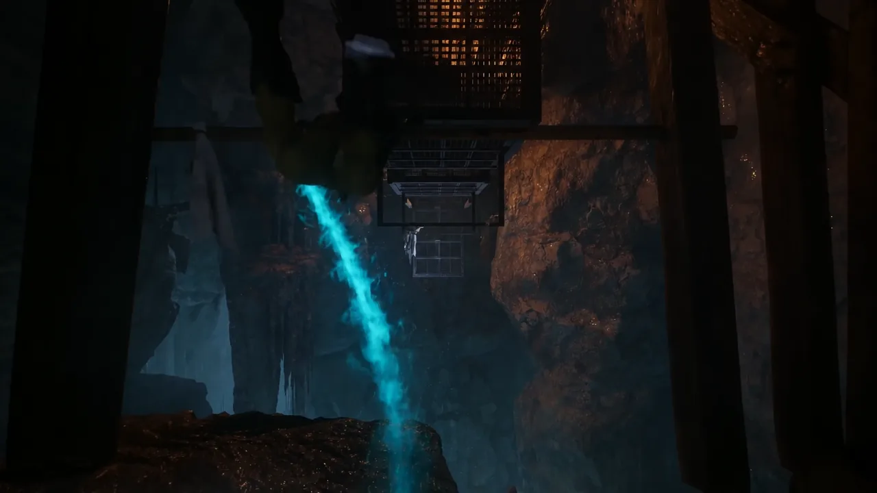 Blue energy flowing below suspended metal platforms inside the cavern section