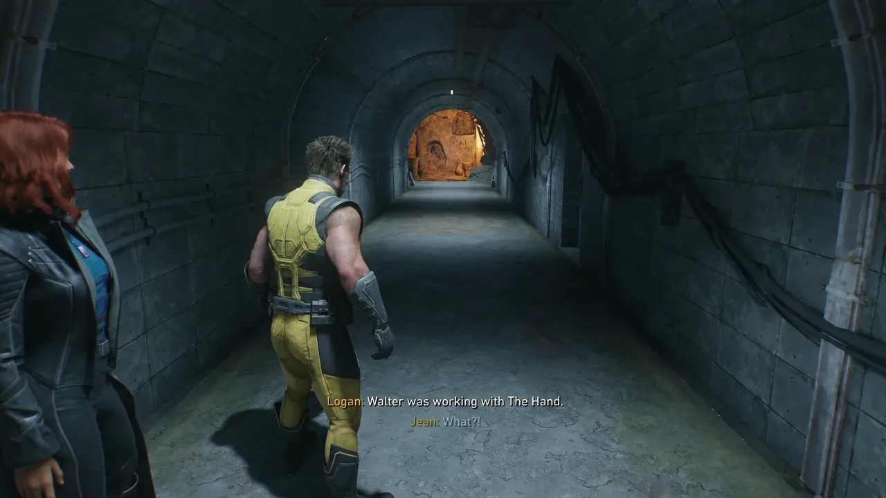 Logan and Jean walking through a corridor with dialogue subtitles on screen