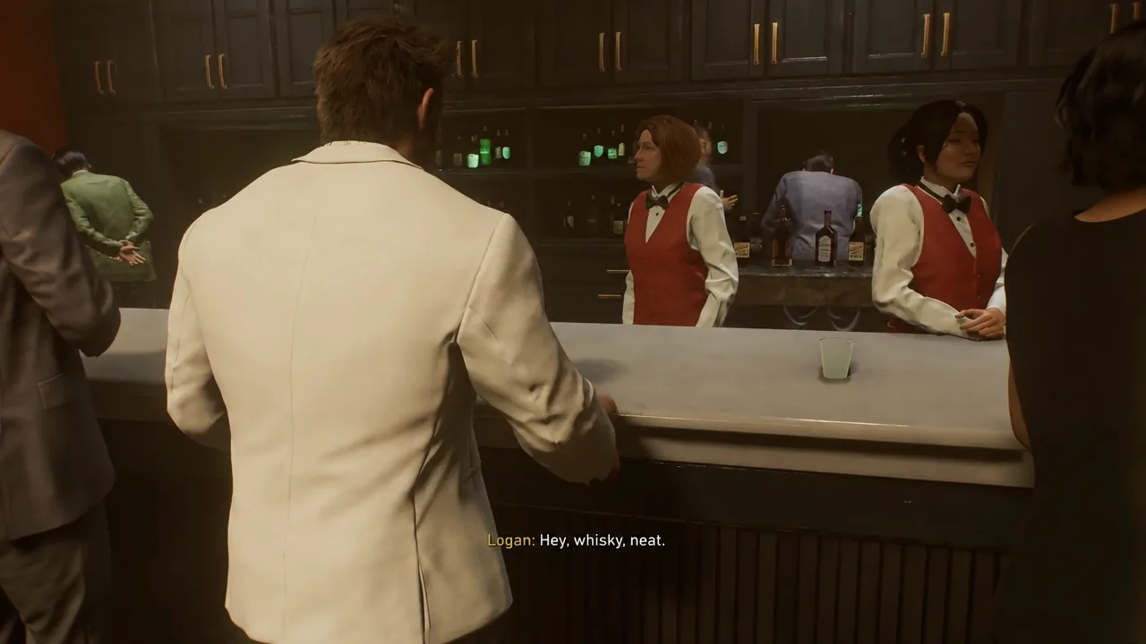 Logan leans on the upstairs casino bar and orders a whisky neat from the bartender
