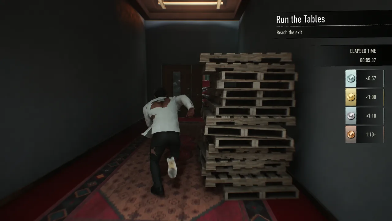 The Run the Tables trial in progress as Logan vaults past stacked pallets on the way to the exit