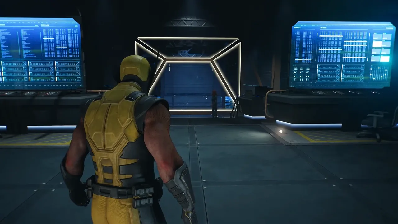 Logan walking toward a lit console at the center of the room during Mission 28 in Madripoor