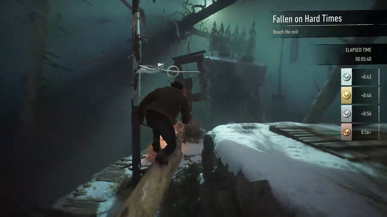Logan crosses a narrow snow-covered beam while the Reach the exit prompt stays on the HUD