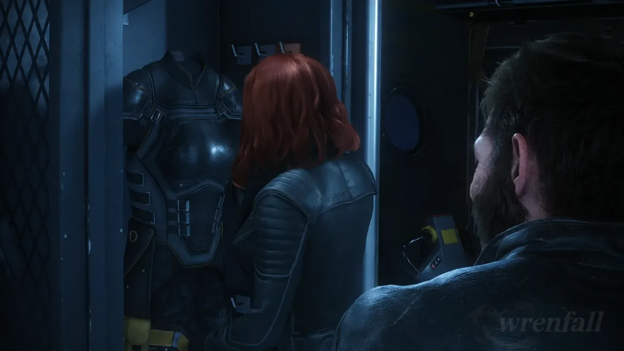 Jean Grey holding up a black stealth suit found in a locker inside the cargo hold