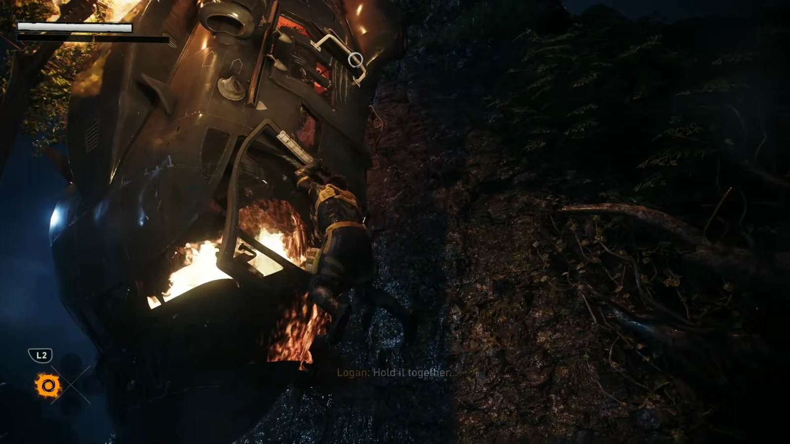 Logan hanging from burning wreckage with the L2 hold prompt on screen during the climb