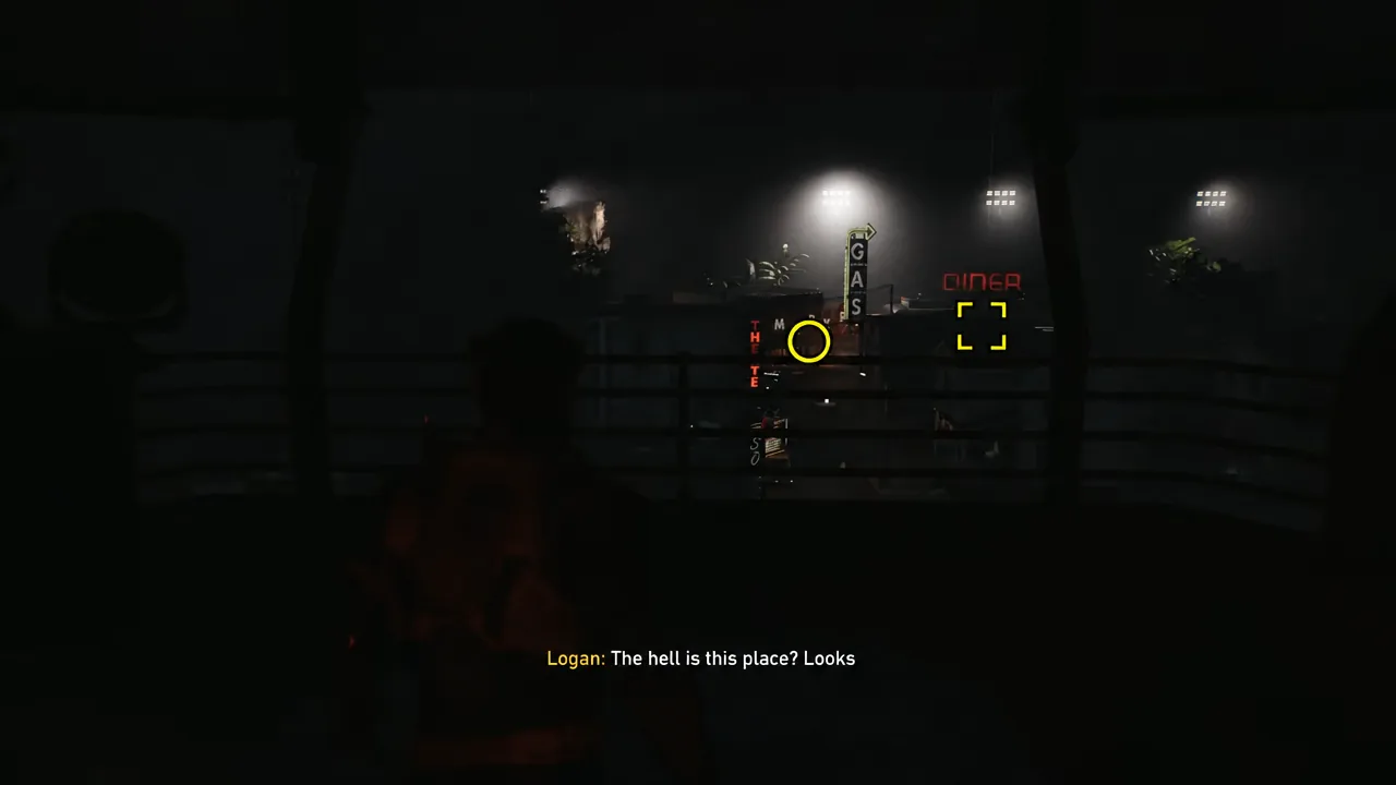 Yellow aiming reticle on a gas station sign with the lit diner ahead in the fake town