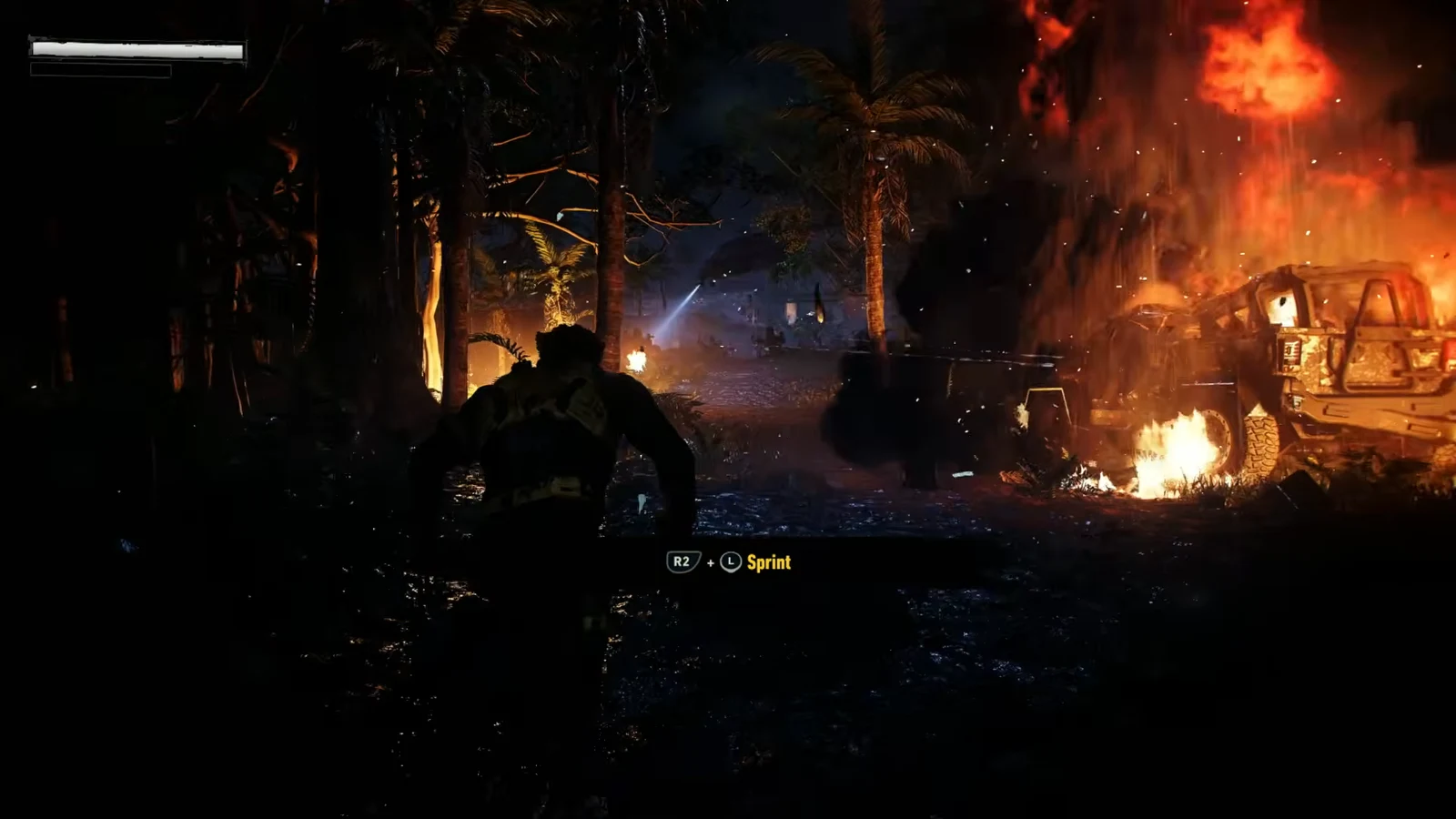 Sprint prompt showing R2 plus left stick as Logan runs through a burning nighttime jungle