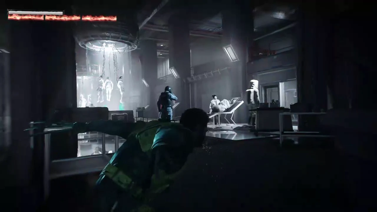 Logan crouching behind cover in a dim lab with mutants suspended in tanks ahead