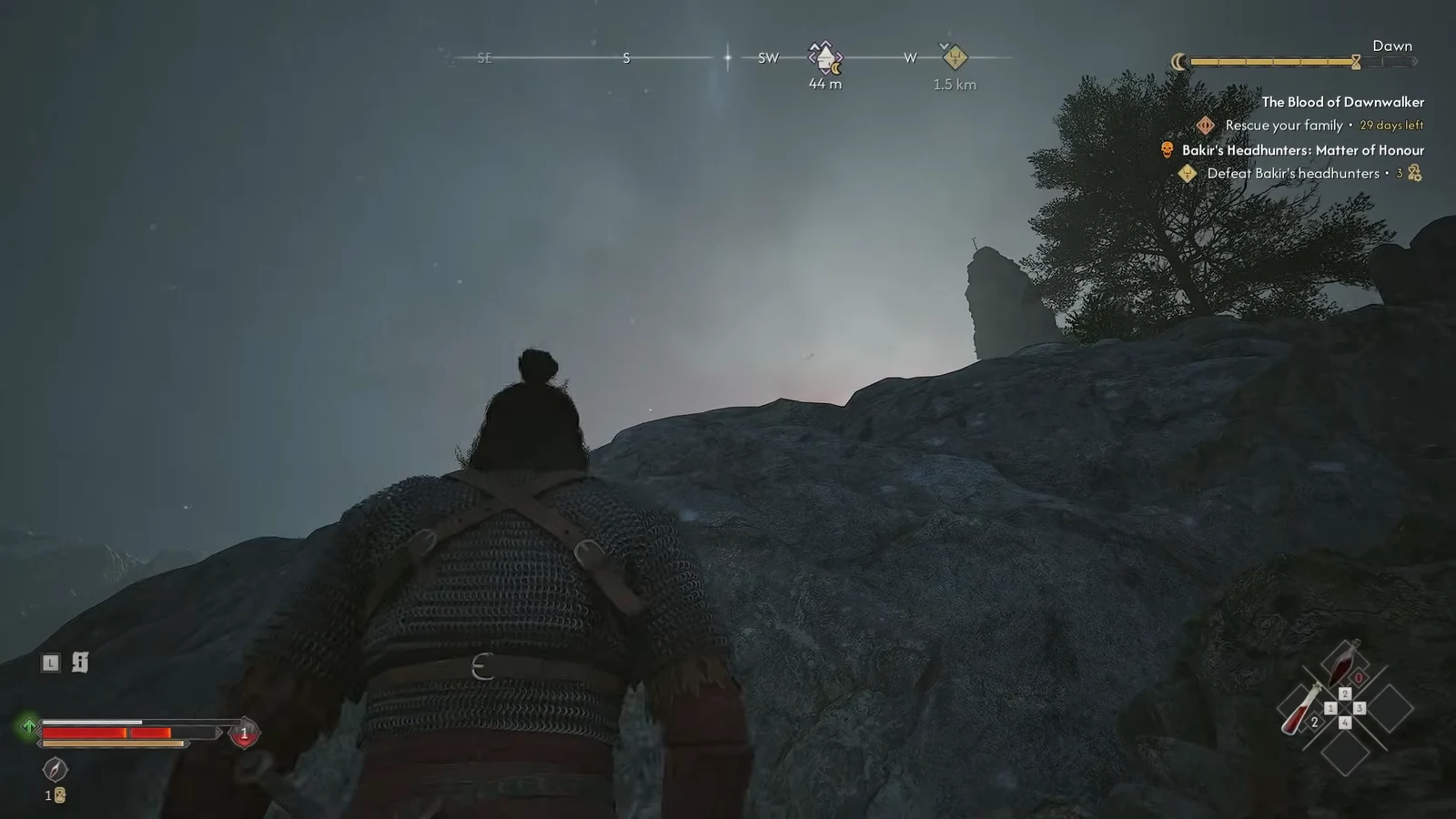 Player scaling a steep rocky slope on the approach to the ruined tower