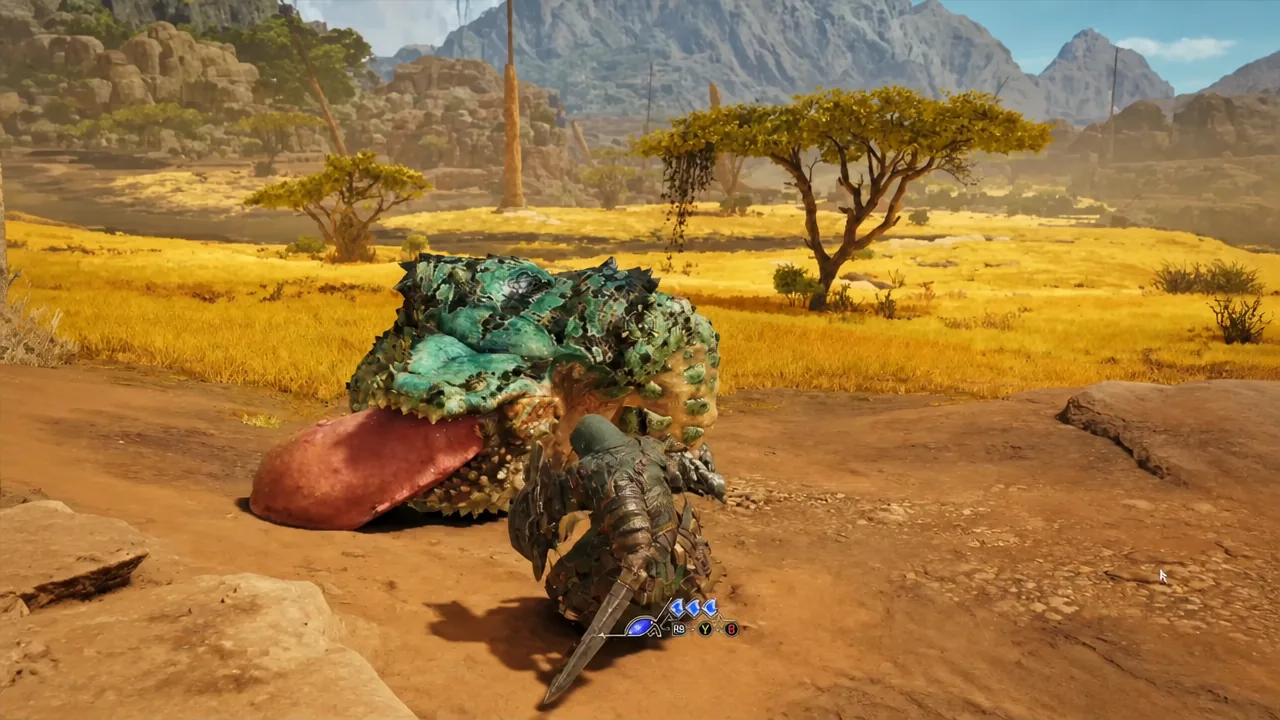 Armored hunter striking a large frog-like monster with controller prompts shown at the bottom of the screen