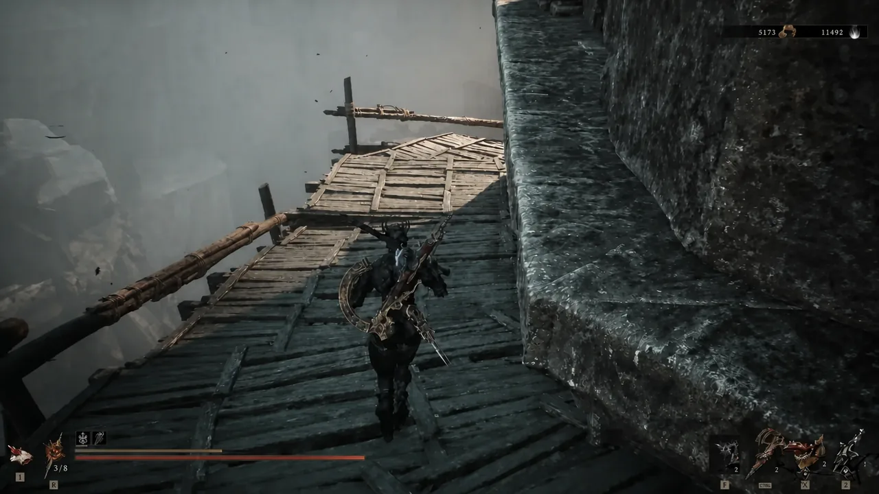 Player crossing a narrow wooden walkway built into the cliffside beside the castle wall