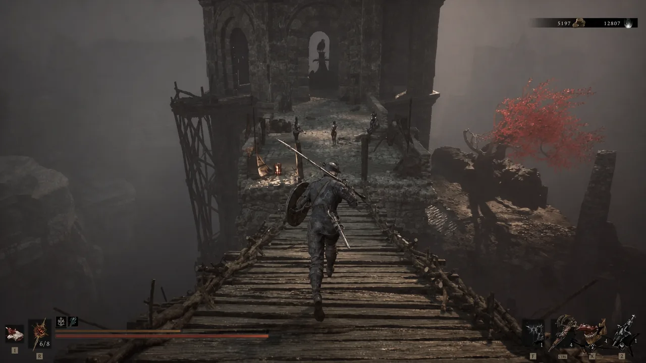 Crossing the wooden bridge toward the stone tower with enemies waiting on the far side