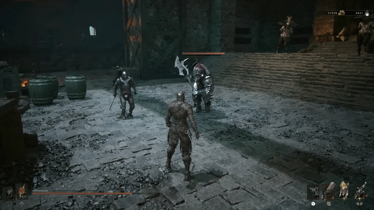 Player character fighting two armored enemies in a stone courtyard at the dungeon exit