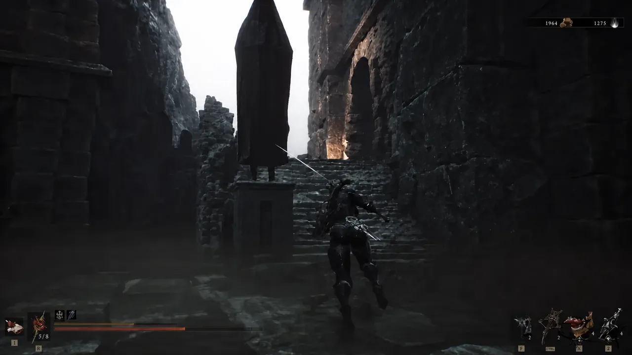 Player climbing the tomb stairs toward an enemy on the level with the breakable wall