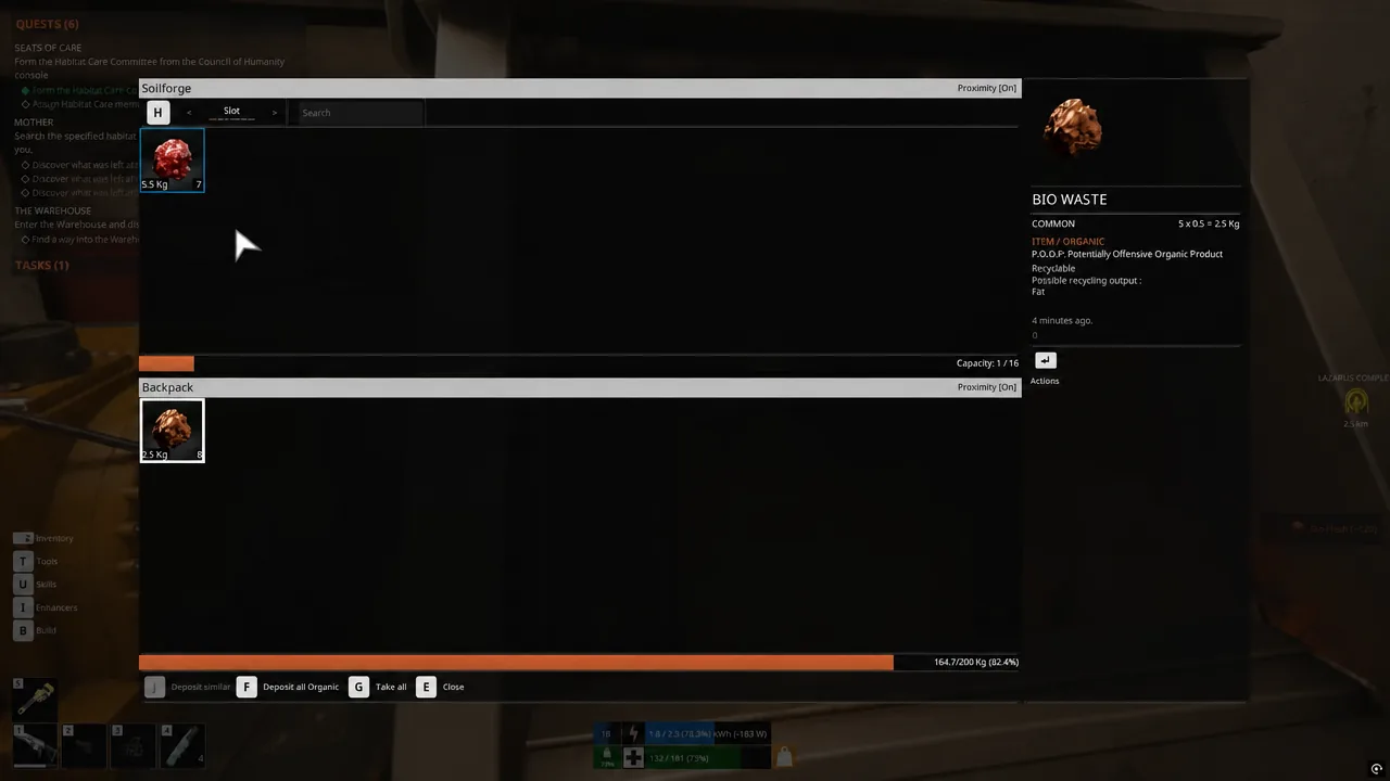 Soilforge container screen open while organic material is deposited into the input slot.