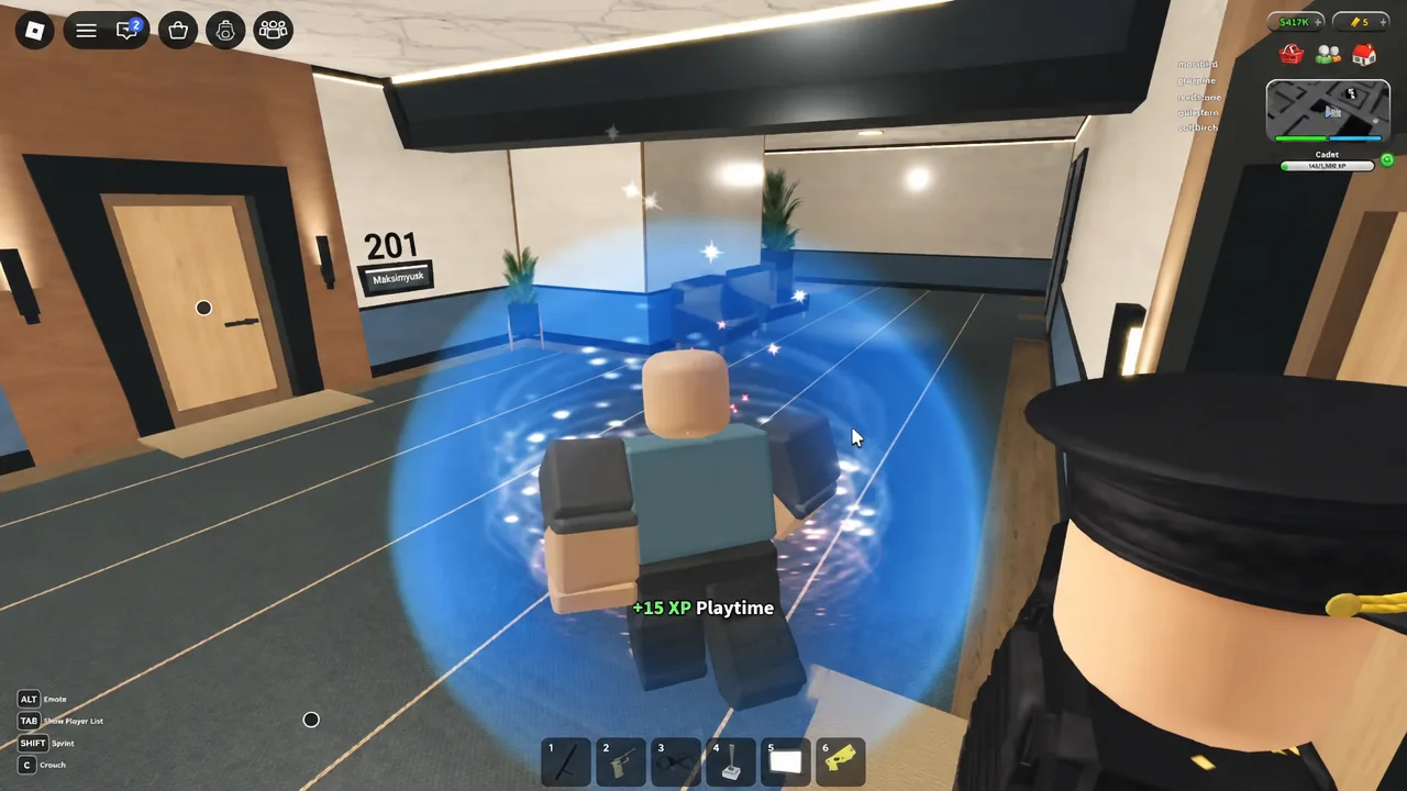 Player standing in a glowing blue zone outside apartment room 201 as a plus 15 XP playtime reward appears.